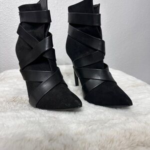 Sleek Black Heeled Boots with Stiletto Heel and Unique Wrap-Around Design